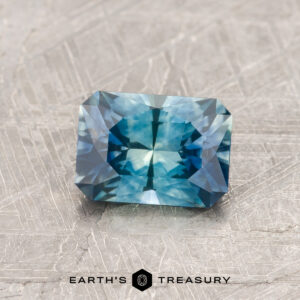 A blue-green Montana sapphire in our "Fourth of July" rectangle design