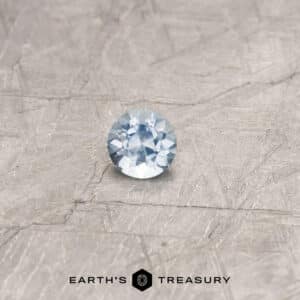 A blue Umba sapphire in a classic diamond round brilliant design