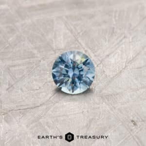 A particolored Montana sapphire in a classic diamond round brilliant design