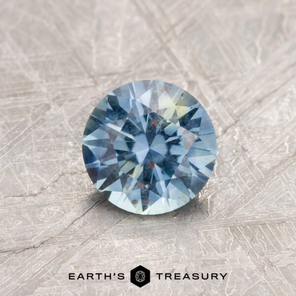 0.84-Carat Montana Sapphire A particolored Montana sapphire in a classic diamond round brilliant design