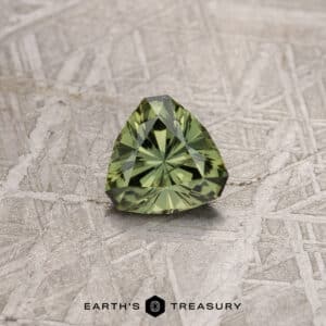A green Australian Sapphire in our "Triptych" trillion design