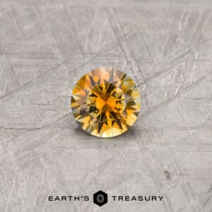 A yellow Montana sapphire in a classic diamond round brilliant design