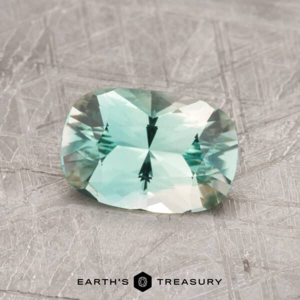 A blue-green tourmaline in a custom oval design