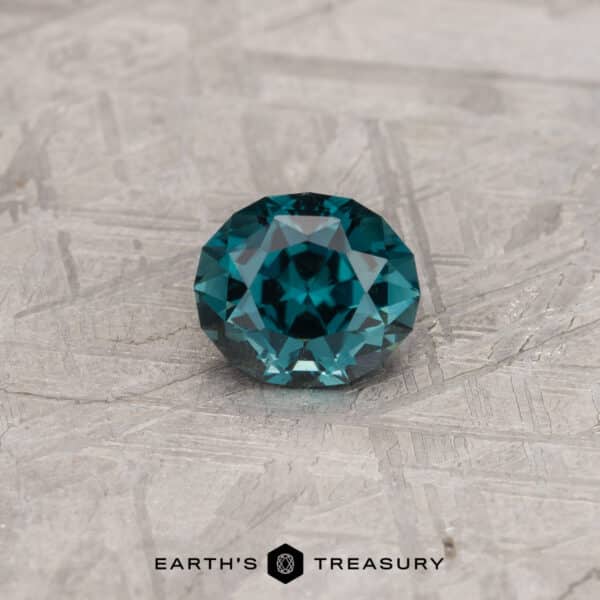 1.27-Carat Tourmaline A blue-green oval tourmaline in a custom oval design