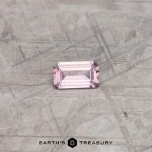 A pink Montana sapphire in a classic emerald cut