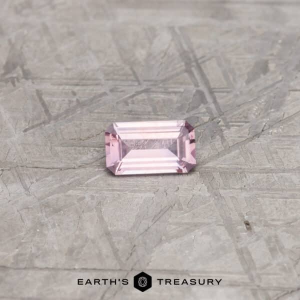 A pink Montana sapphire in a classic emerald cut