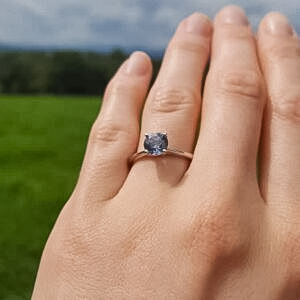 A photo from a customer review featuring a ring with a Montana sapphire