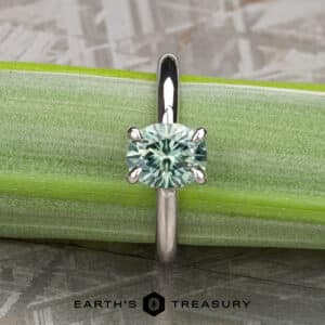The “Fleur” Solitaire in platinum with 1.43-Carat Green Montana Sapphire