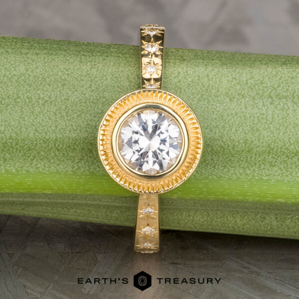 The “Serafina” Halo Ring in 18k yellow gold with 1.21-carat Montana sapphire The “Serafina” Halo Ring in 18k yellow gold with 1.21-carat Montana sapphire