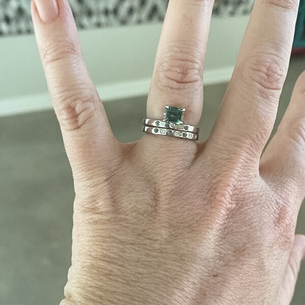 A photo from a customer review featuring an "Aurai" Ring in 14k white gold with 1.07-Carat Montana Sapphire, alongside an "Aurai" band in 14k white gold