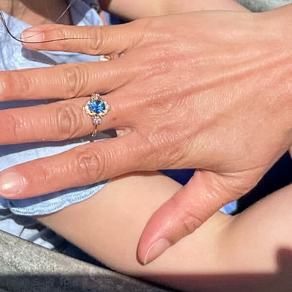 A photo from a customer review featuring a custom ring in 20k pink gold with 1.69-Carat Ceylon Sapphire