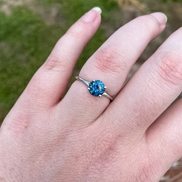 A photo from a customer review featuring a "Phoebe" ring in 14k white gold with 1.41-Carat Montana Sapphire