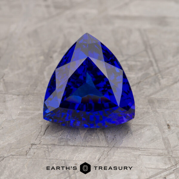 A vivd blue tanzanite in a custom trillion design