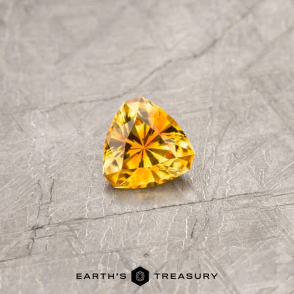An orange Montana sapphire in our "Triptych" triangle design