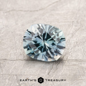 An aqua Montana sapphire in our "Hyperbola" oval design