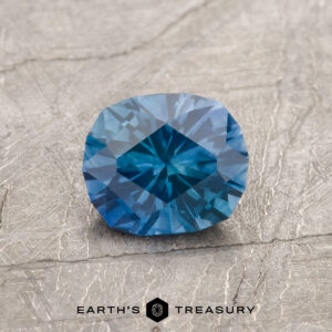 A blue Montana sapphire in our "Hyperbola" oval design