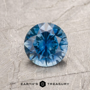 A blue Montana sapphire in a classic diamond round brilliant design