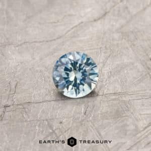 An aqua Montana sapphire in a classic diamond round brilliant design