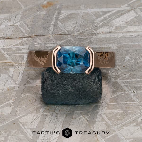 The Wide "Larisa" ring in 14k rose gold, hammered and polished, with 2.28-Carat Montana Sapphire