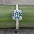 The Deluxe Pave “Madeline” Hidden Halo Ring in 18k white gold with 2.72-Carat Montana Sapphire