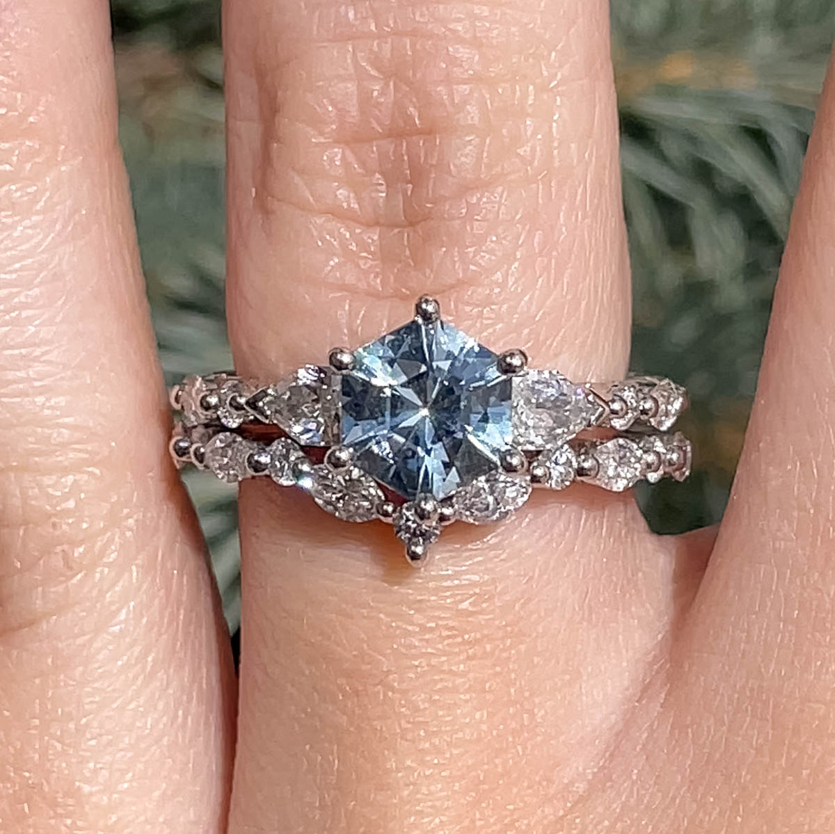 The "Morrigan" in platinum with 2.06-Carat Montana Sapphire, alongside the "Alzette" band in platinum