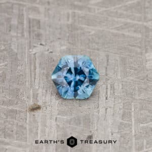 A blue-green Montana sapphire in our "Sparkling Snowflake" hexagon design