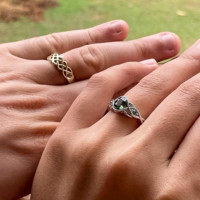 A photo from a customer review featuring a 14k yellow "Rowan" ring and a platinum "Isolde" ring with 1.22-carat Australian sapphire