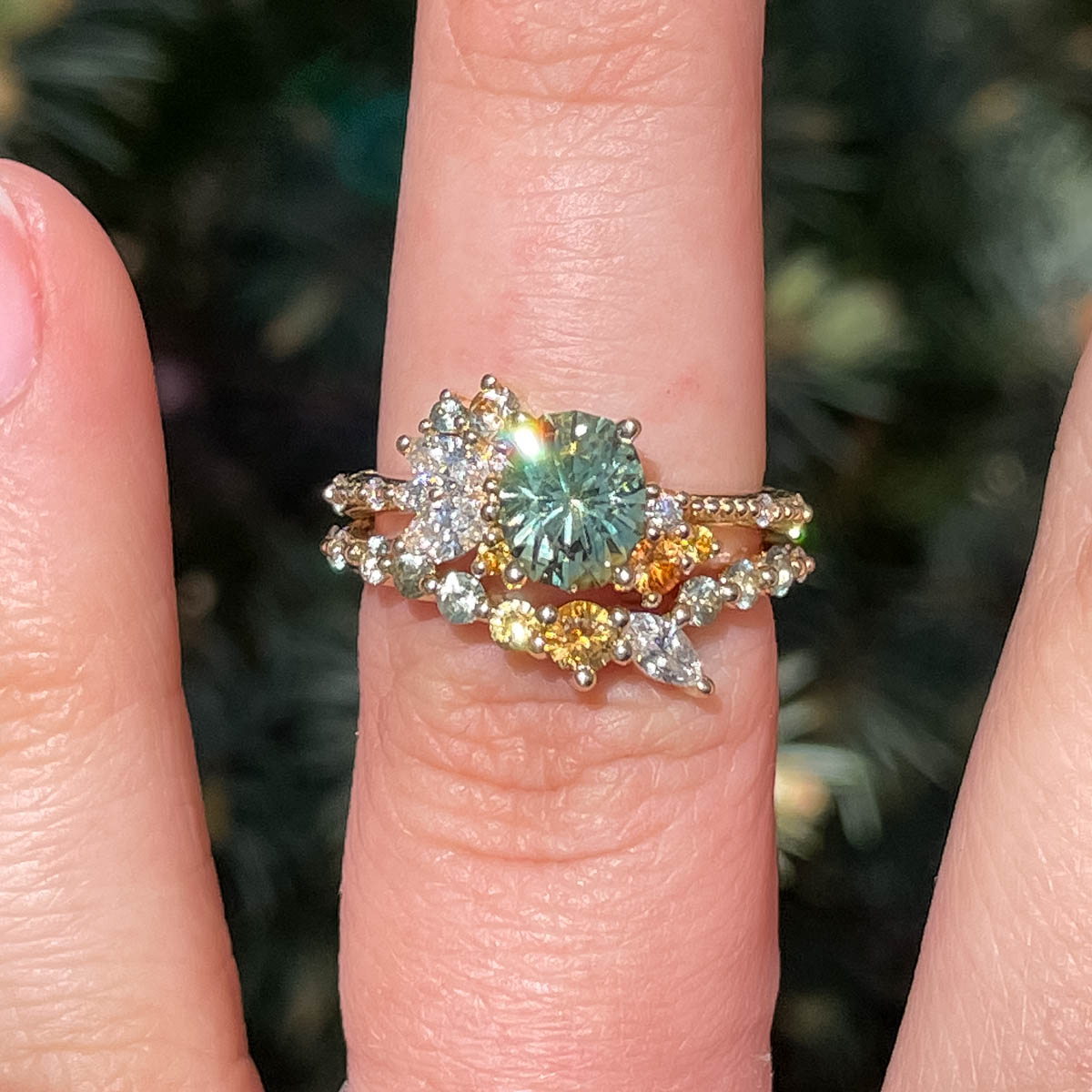 The "Ilana" ring in 14K yellow gold with a 1.39-carat Montana sapphire, alongside the "Ilana" band in 14K yellow gold