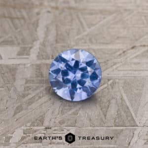 A blue Umba sapphire in a classic diamond round brilliant design