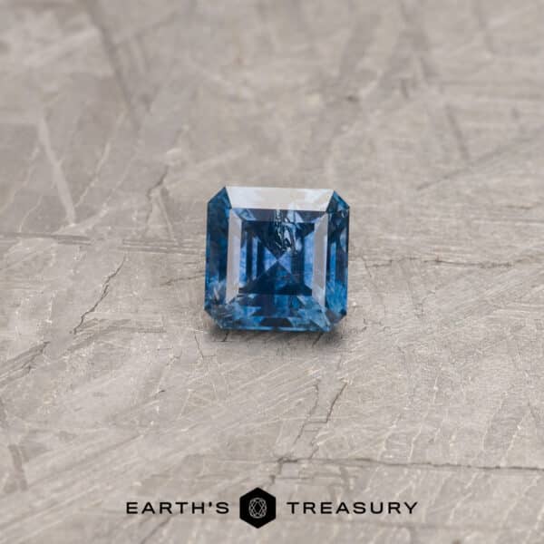 A blue Montana sapphire in a classic asscher-style square design