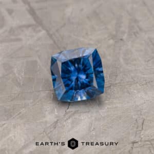 A blue Montana sapphire in our "Aurora" square cushion design