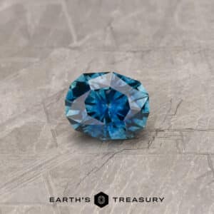 A blue-green Montana sapphire in our "Orion" oval design