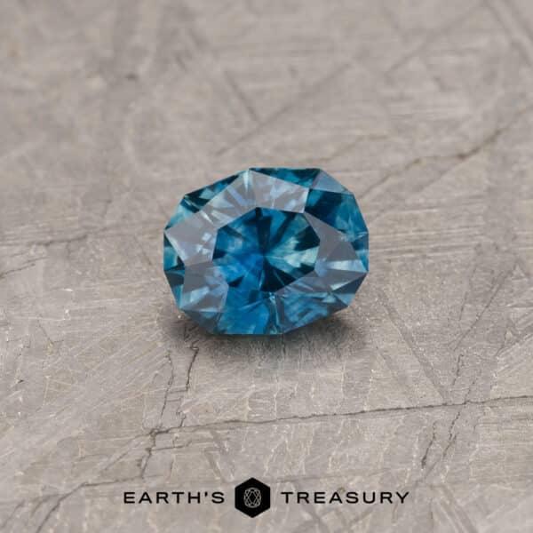 A blue-green Montana sapphire in our "Orion" oval design