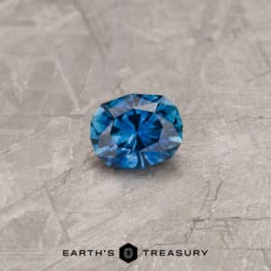 A blue-green Montana sapphire in our "Orion" oval design