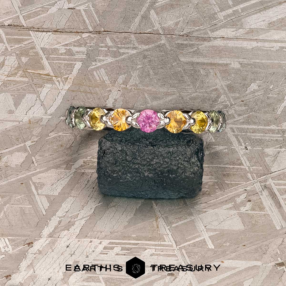 A custom band in 14K white gold with Montana sapphires