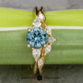 The "Multiflora" ring in 18k yellow gold with 1.43-carat Montana sapphire alongside the "Multiflora" band in 18k yellow gold