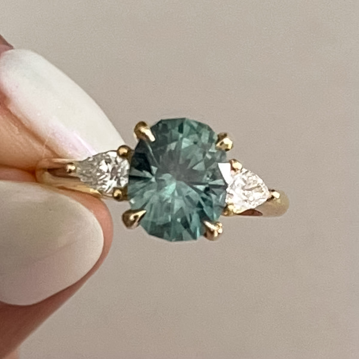 A ring not made by Earth's Treasury including a 2.30-Carat Spruce Green Montana Sapphire