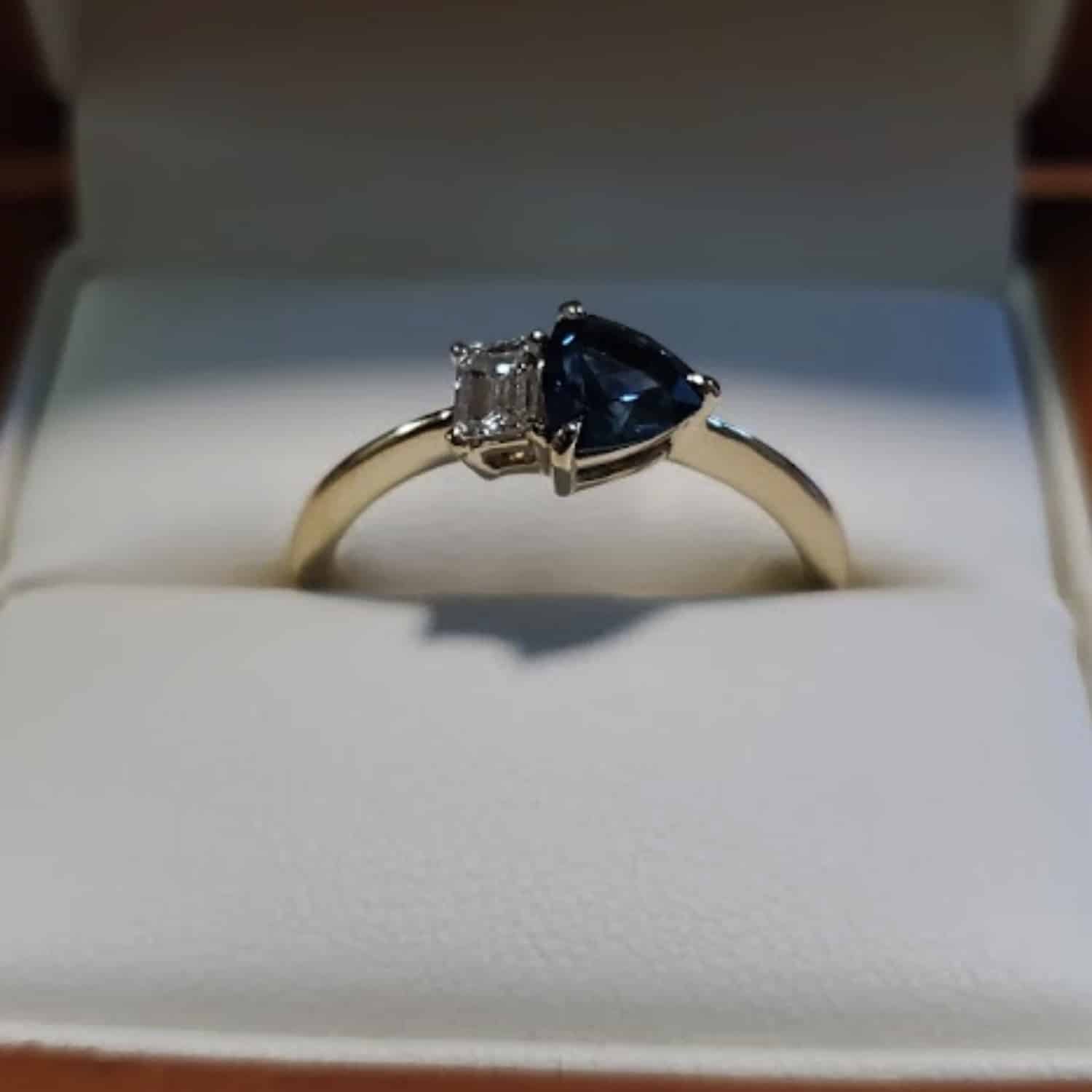 A photo from a customer review showing a Toi et Moi ring in a ring box