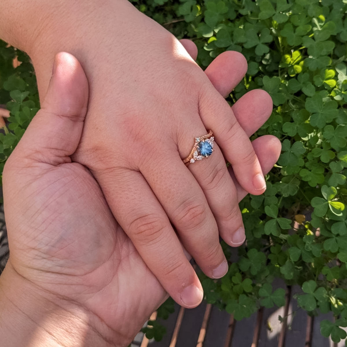 The "Cattleya" ring in 14K rose gold with 1.89-carat Montana sapphire, alongside the "Passiflora" band in 14K rose gold