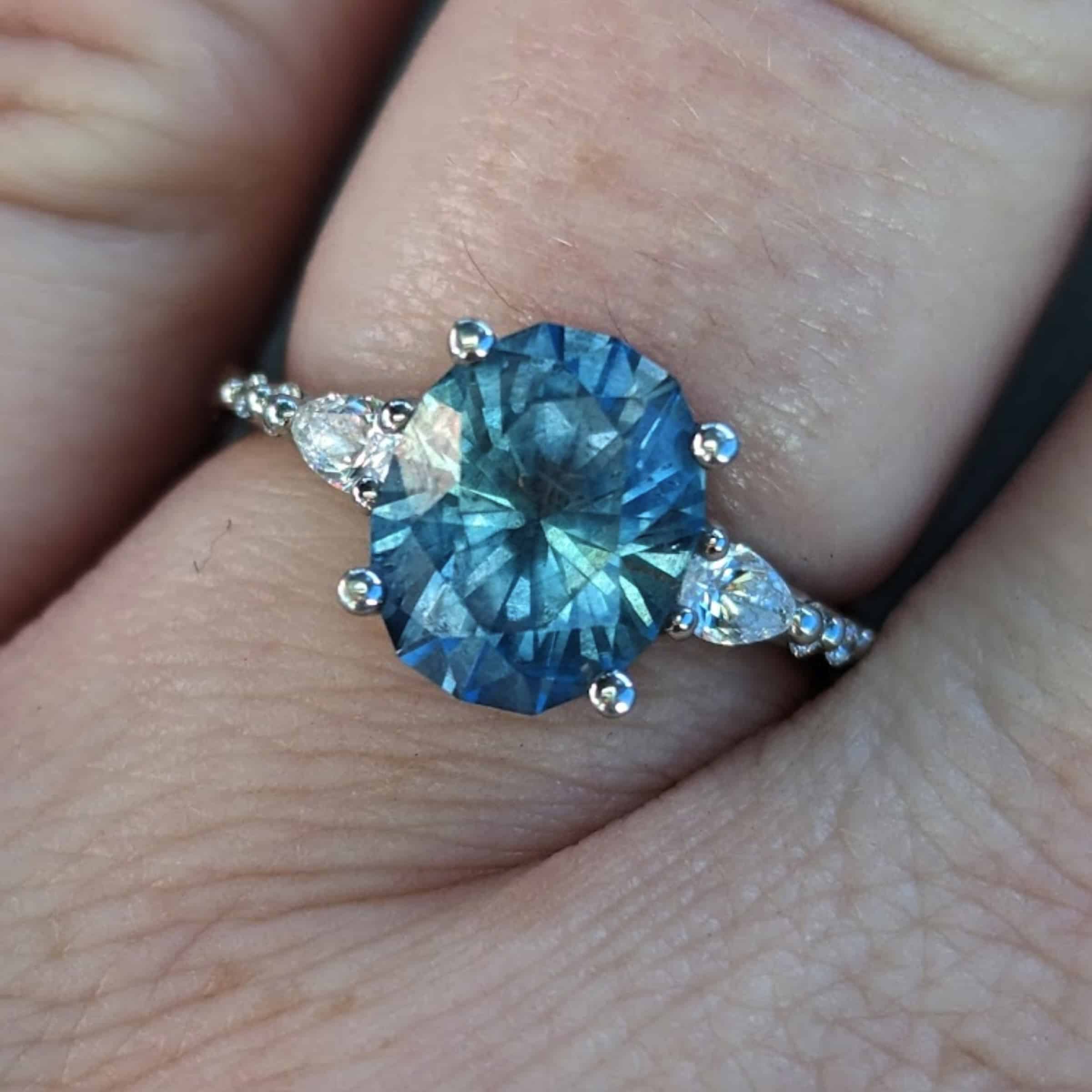 A photo from a customer review, featuring the "Carina" ring in platinum with 3.87-Carat Montana Sapphire