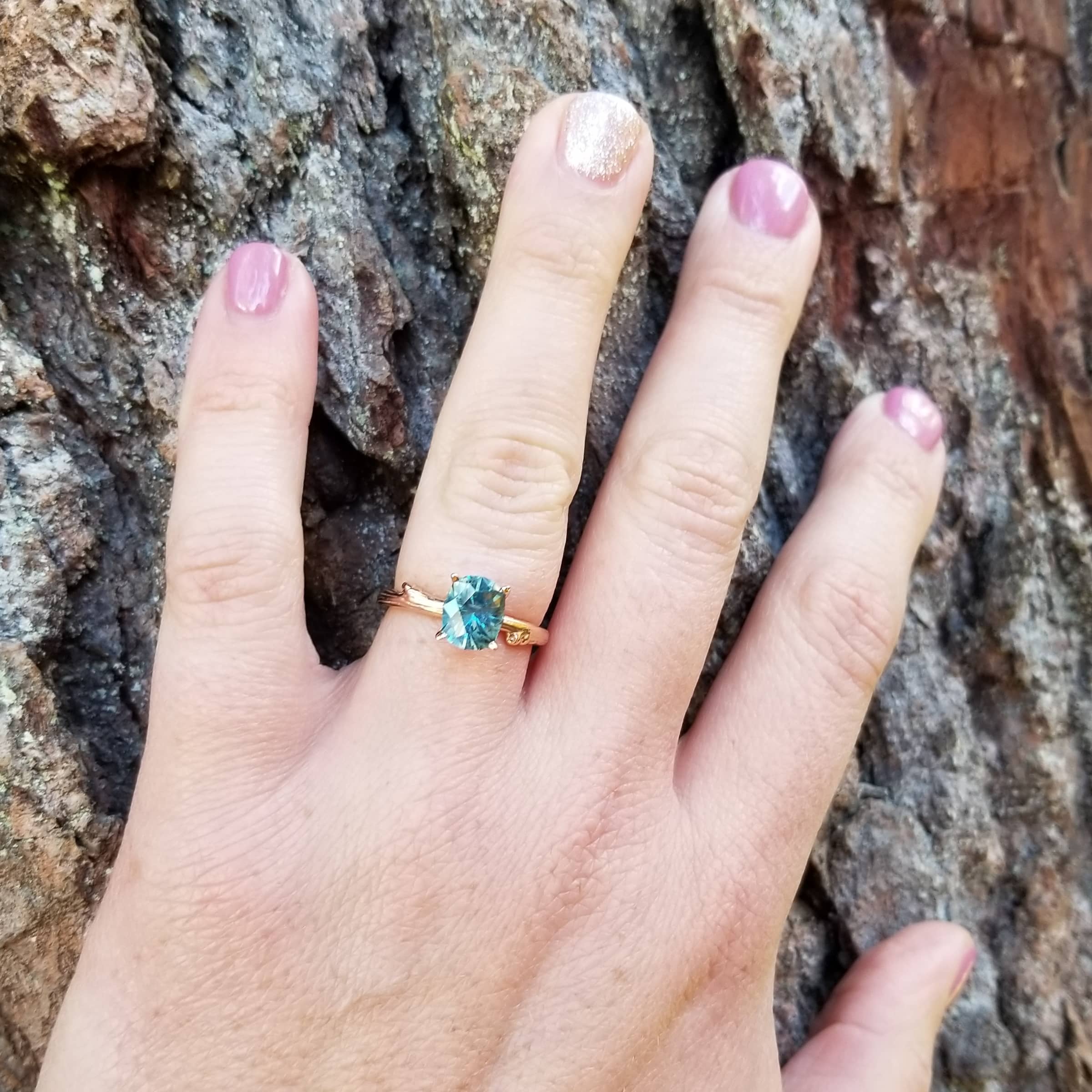 A photo from a customer review featuring a "Twyg" ring in 14k rose gold with a 2.16-carat Montana sapphire