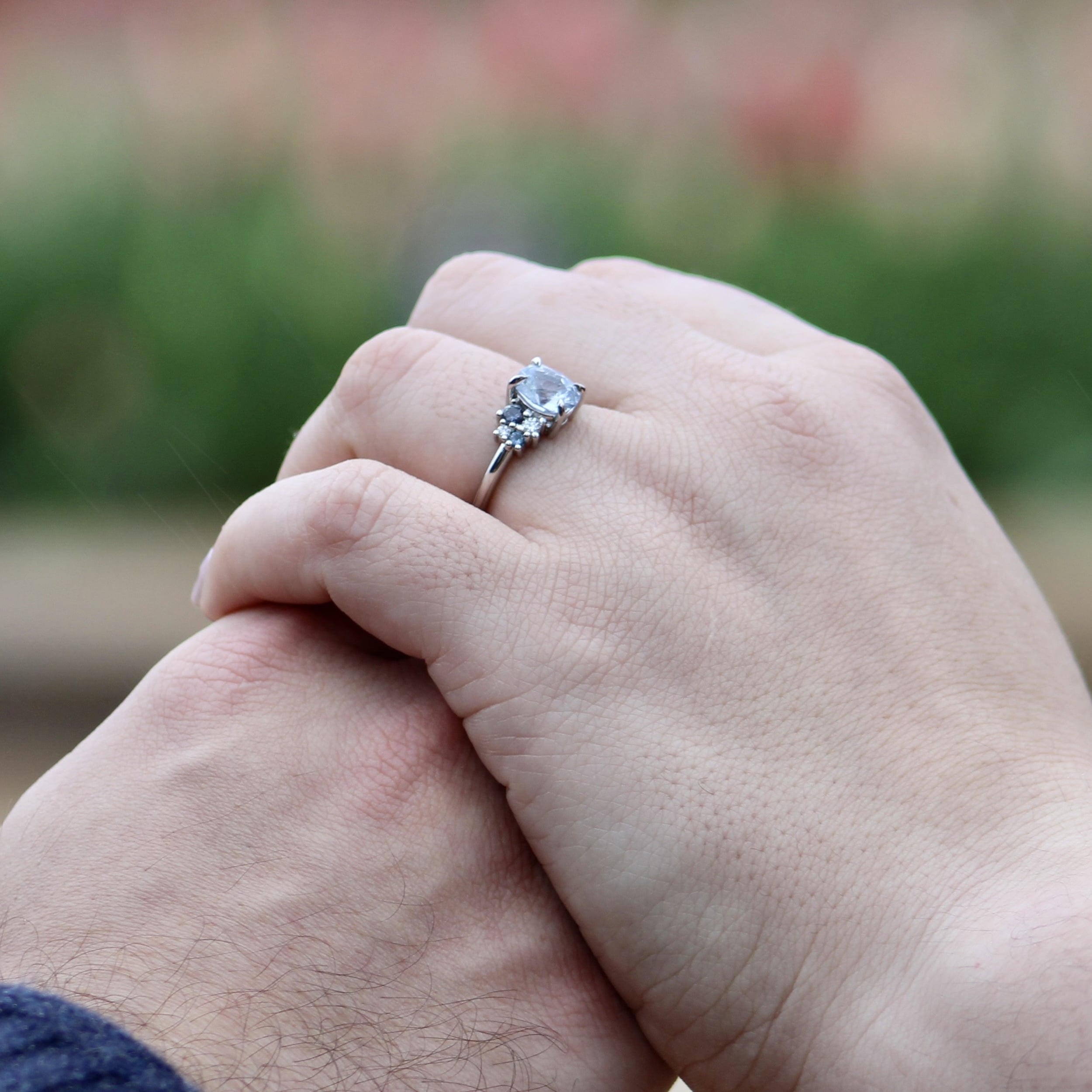 A photo from a customer review featuring a custom "Nebula" ring in platinum with a 2.34-carat Montana sapphire