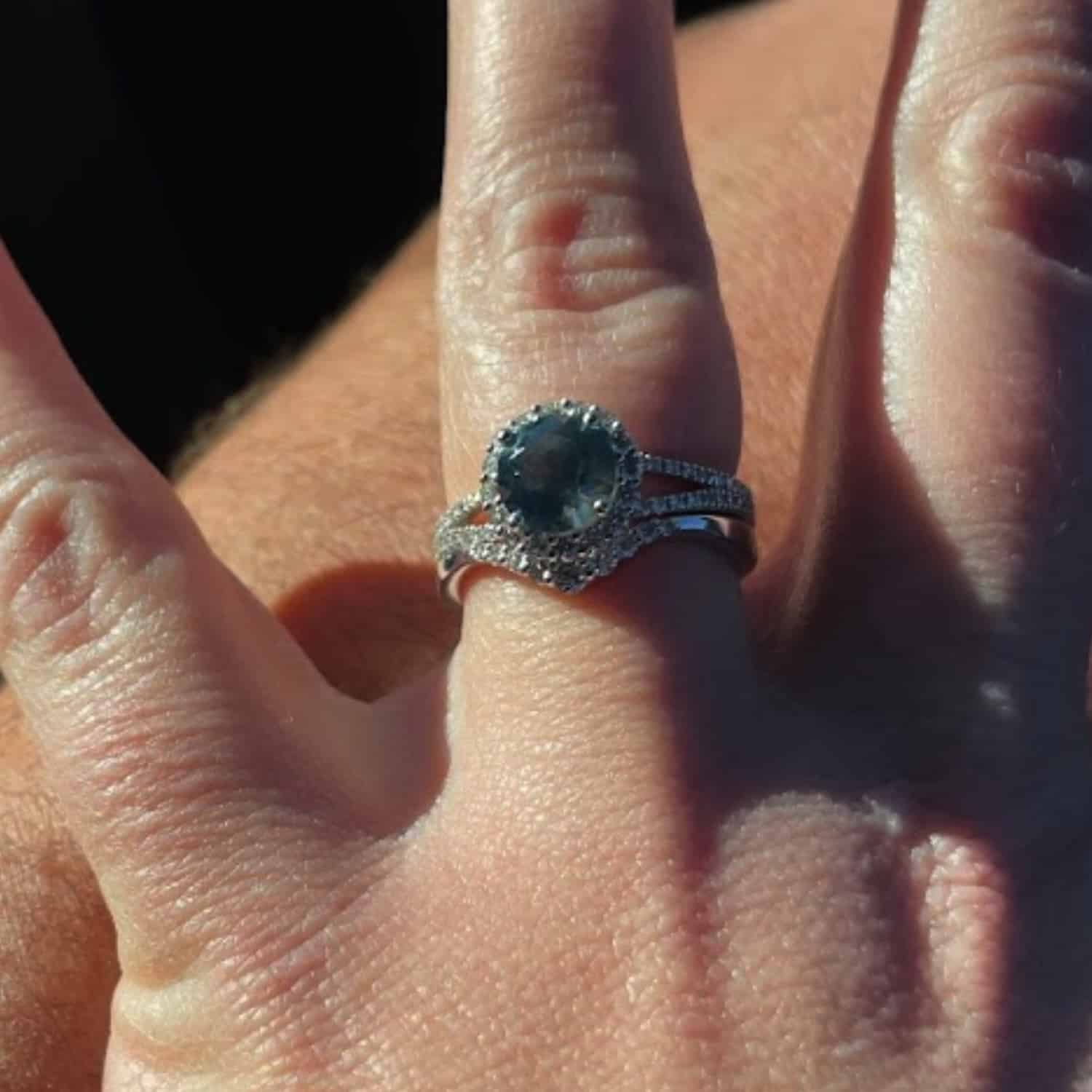 A photo from a customer review featuring a white gold "Charlotte" ring and "Rhine" band