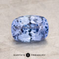 The 2.09-Carat Celyon Sapphire, a faceted, rectangular light blue gemstone with intricate internal reflections, is placed on a textured gray background.