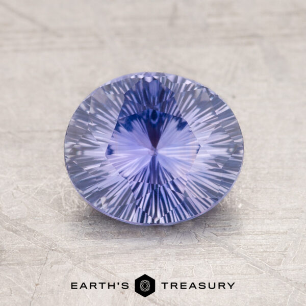 1.76-Carat Celyon Sapphire Displayed on a textured surface, a round 1.76-Carat Ceylon Sapphire with intricate facets captures the eye while the words "Earth's Treasury" appear at the bottom.