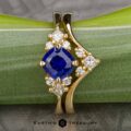 The Bypass "Sappho" ring in 18k yellow gold with 1.05-Carat Ceylon Sapphire, alongside the "Sappho" band in 18k yellow gold