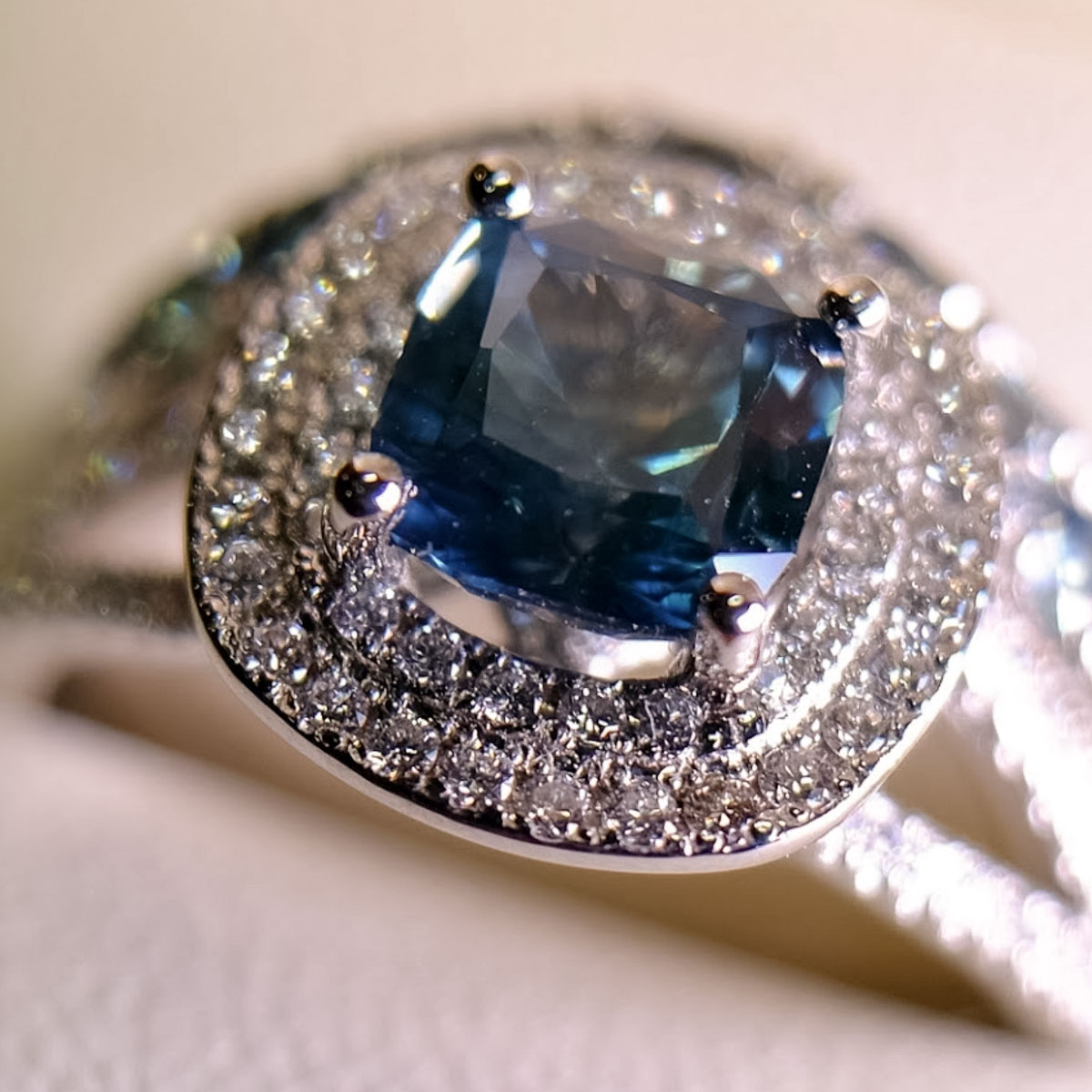A custom halo ring in platinum with a 1.98-carat Montana sapphire