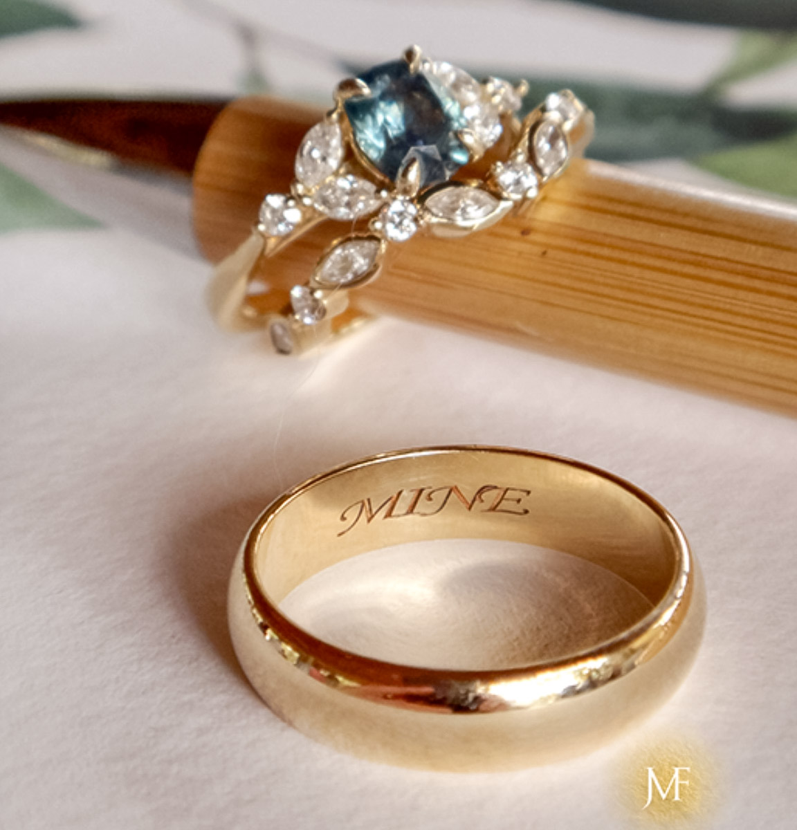 The "Cattleya" ring in 14K yellow gold with 1.40-carat Montana sapphire; the Thames band in 14K yellow gold; and the classic standard-fit band in 14K yellow gold