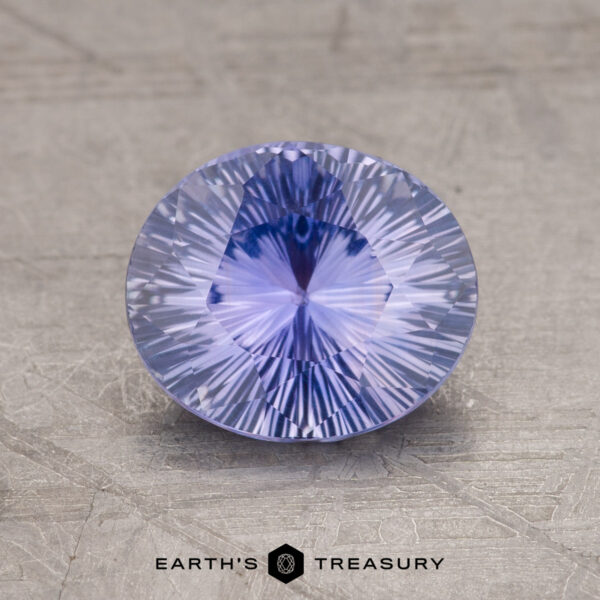 1.76-Carat Purple Ceylon Sapphire Displayed on a textured surface, a round 1.76-Carat Ceylon Sapphire with intricate facets captures the eye while the words "Earth's Treasury" appear at the bottom.