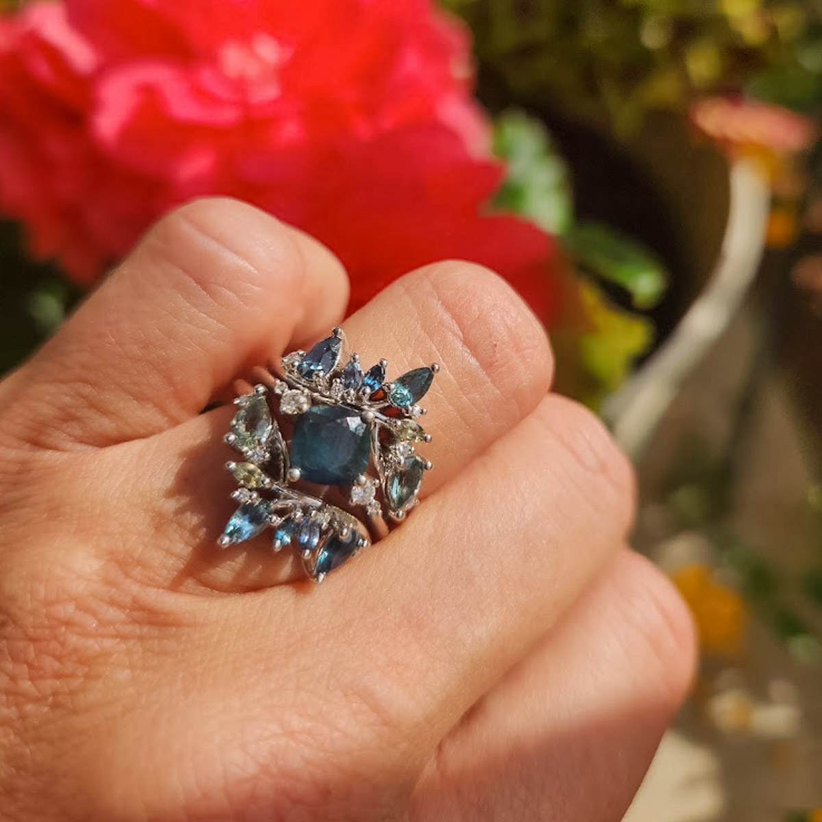 The "Selene" ring in 14K white gold with 1.42-carat Montana sapphire, alongside a custom sapphire wedding band jacket
